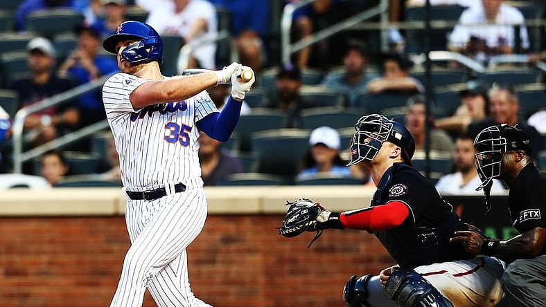 Aug 11, 2021; New York, New York, USA; New York Mets pinch hitter Brandon Drury (35) hits an RBI single against the Washington Nationals during the eighth inning at Citi Field Mandatory Credit: Andy Marlin-USA TODAY Sports