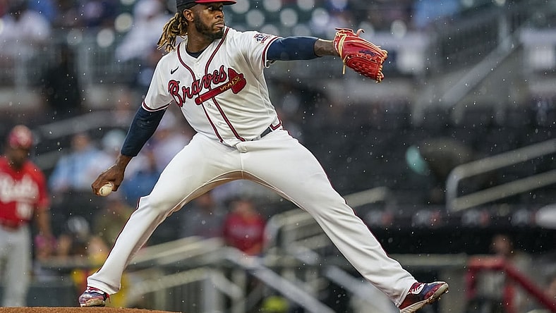 Aug 11, 2021; Cumberland, Georgia, USA; Atlanta Braves starting pitcher Touki Toussaint (62) pitches against the Cincinnati Reds during the first inning at Truist Park. Mandatory Credit: Dale Zanine-USA TODAY Sports