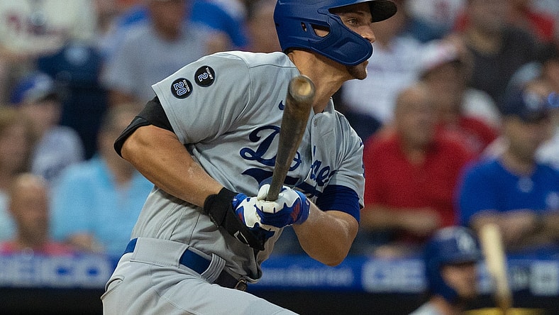Aug 11, 2021; Philadelphia, Pennsylvania, USA; Los Angeles Dodgers shortstop Corey Seager (5) hits a single against the Philadelphia Phillies during the first inning at Citizens Bank Park. Mandatory Credit: Bill Streicher-USA TODAY Sports