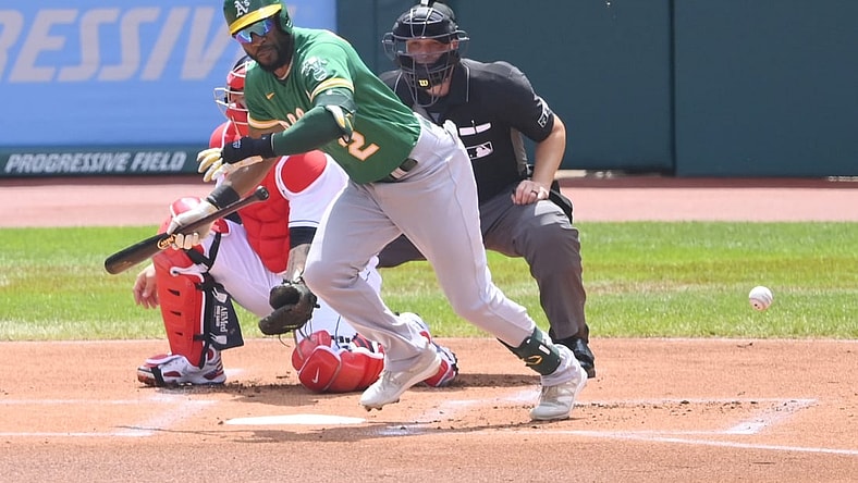 Aug 12, 2021; Cleveland, Ohio, USA; Oakland Athletics center fielder Starling Marte (2) bunts in the first inning against the Cleveland Indians at Progressive Field. Mandatory Credit: David Richard-USA TODAY Sports