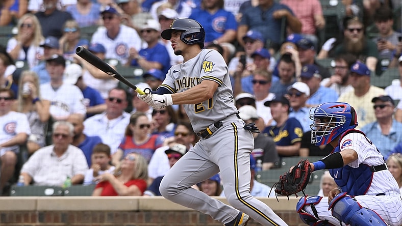 Aug 12, 2021; Chicago, Illinois, USA; Milwaukee Brewers shortstop Willy Adames (27) hits a two-RBI single against the Chicago Cubs during the second inning at Wrigley Field. Mandatory Credit: Matt Marton-USA TODAY Sports