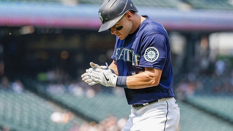 Aug 12, 2021; Seattle, Washington, USA; Seattle Mariners center fielder Jarred Kelenic (10) reacts after hitting a sacrifice fly against the Texas Rangers during the fourth inning at T-Mobile Park. Mandatory Credit: Joe Nicholson-USA TODAY Sports