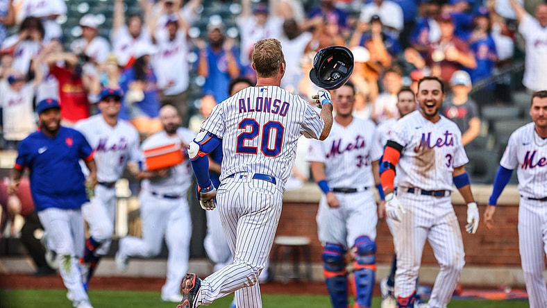 Aug 12, 2021; New York City, NY, USA; New York Mets first baseman Pete Alonso (20) celebrates with teammates  after hitting game winning home run during the eighth inning against the Washington Nationals at Citi Field. Mandatory Credit: Vincent Carchietta-USA TODAY Sports