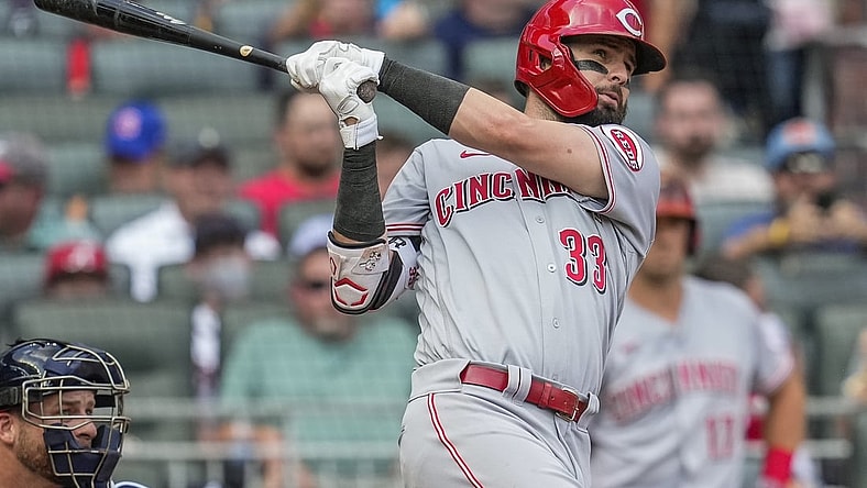 Aug 12, 2021; Cumberland, Georgia, USA; Cincinnati Reds left fielder Jesse Winker (33) hits a grand slam home run against the Atlanta Braves during the second inning at Truist Park. Mandatory Credit: Dale Zanine-USA TODAY Sports