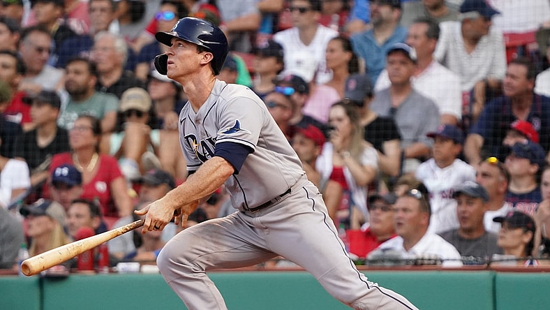 Aug 12, 2021; Boston, Massachusetts, USA; Tampa Bay Rays third baseman Joey Wendle (18) hits a triple against the Boston Red Sox during the eighth inning at Fenway Park. Mandatory Credit: David Butler II-USA TODAY Sports