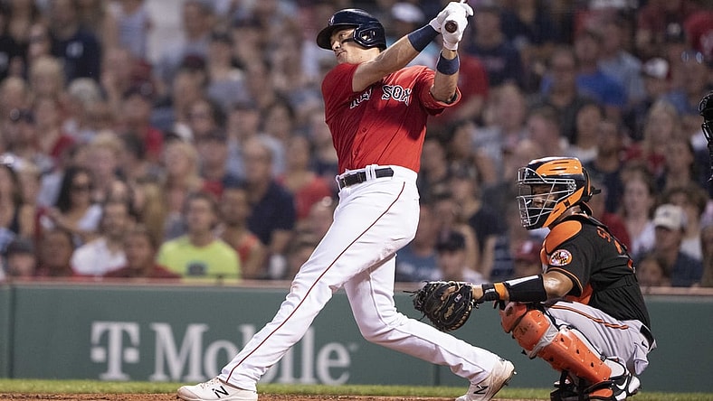 Aug 13, 2021; Boston, Massachusetts, USA; Boston Red Sox first baseman Bobby Dalbec (29) hits an RBI double during the second inning against the Baltimore Orioles at Fenway Park. Mandatory Credit: Gregory Fisher-USA TODAY Sports