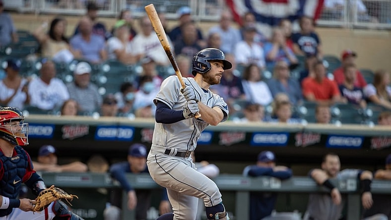 Aug 13, 2021; Minneapolis, Minnesota, USA; Tampa Bay Rays second baseman Brandon Lowe (8) hits a single during the first inning against the Minnesota Twins at Target Field. Mandatory Credit: Jordan Johnson-USA TODAY Sports