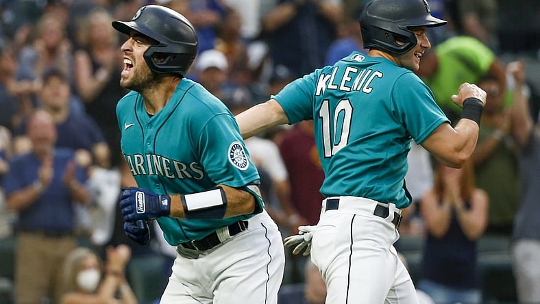 Aug 13, 2021; Seattle, Washington, USA; Seattle Mariners catcher Tom Murphy (2) celebrates with center fielder Jarred Kelenic (10) after hitting a two run home run against the Toronto Blue Jays during the third inning at T-Mobile Park. Kelenic scored a run on the hit. Mandatory Credit: Joe Nicholson-USA TODAY Sports