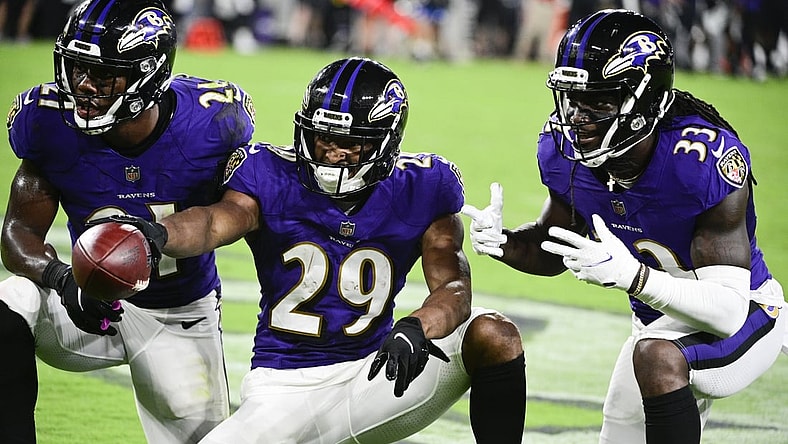 Aug 14, 2021; Baltimore, Maryland, USA; Baltimore Ravens cornerback Shaun Wade (29) celebrates with  cornerback Brandon Stephens (21) and Baltimore Ravens cornerback Davontae Harris (33) after interception a New Orleans Saints quarterback Ian Book (not pictured ) pass  during the second half at M&T Bank Stadium. Mandatory Credit: Tommy Gilligan-USA TODAY Sports