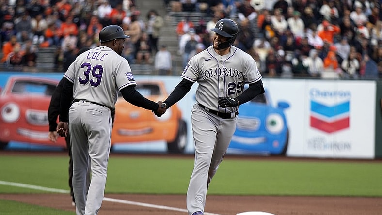 Aug 14, 2021; San Francisco, California, USA; Colorado Rockies first baseman C.J. Cron (25) celebrates with third base coach Stu Cole (39) after hitting a home run against San Francisco Giants starting pitcher Sammy Long (not pictured) during the first inning at Oracle Park. Mandatory Credit: D. Ross Cameron-USA TODAY Sports