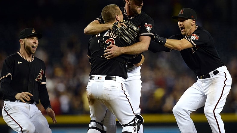Aug 14, 2021; Phoenix, Arizona, USA; Arizona Diamondbacks starting pitcher Tyler Gilbert (49) celebrates with Arizona Diamondbacks third baseman Drew Ellis (27) and Arizona Diamondbacks catcher Daulton Varsho (12) and Arizona Diamondbacks shortstop Nick Ahmed (13) after throwing a no hitter against the San Diego Padres at Chase Field. Mandatory Credit: Joe Camporeale-USA TODAY Sports