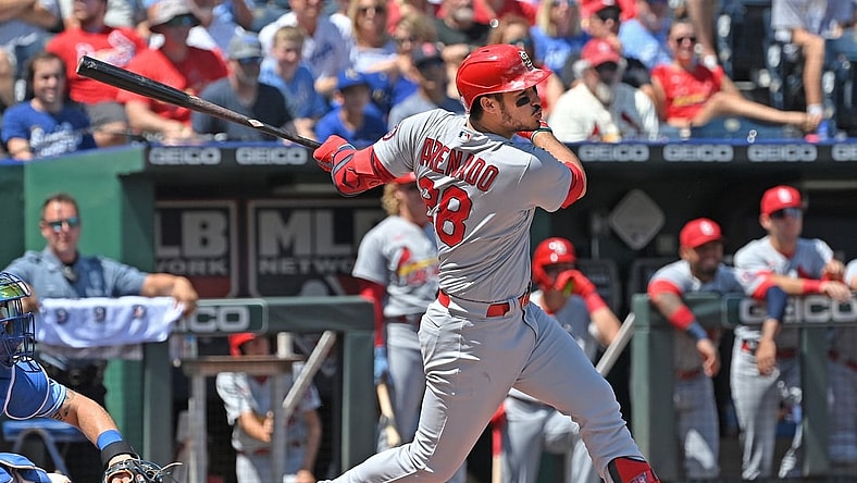 Aug 15, 2021; Kansas City, Missouri, USA; St. Louis Cardinals third baseman Nolan Arenado (28) hits an RBI single during the first inning against the Kansas City Royals at Kauffman Stadium. Mandatory Credit: Peter Aiken-USA TODAY Sports