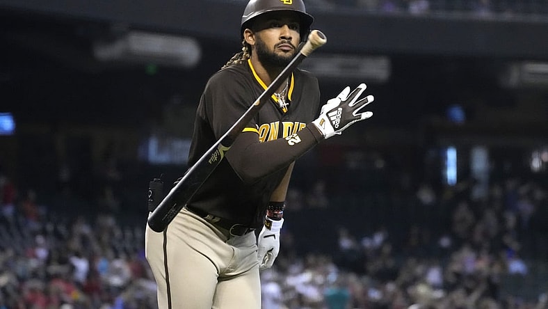 Aug 15, 2021; Phoenix, Arizona, USA; San Diego Padres right fielder Fernando Tatis Jr. (23) tosses his bat after hitting a solo home run against the Arizona Diamondbacks in the first inning at Chase Field. Mandatory Credit: Rick Scuteri-USA TODAY Sports