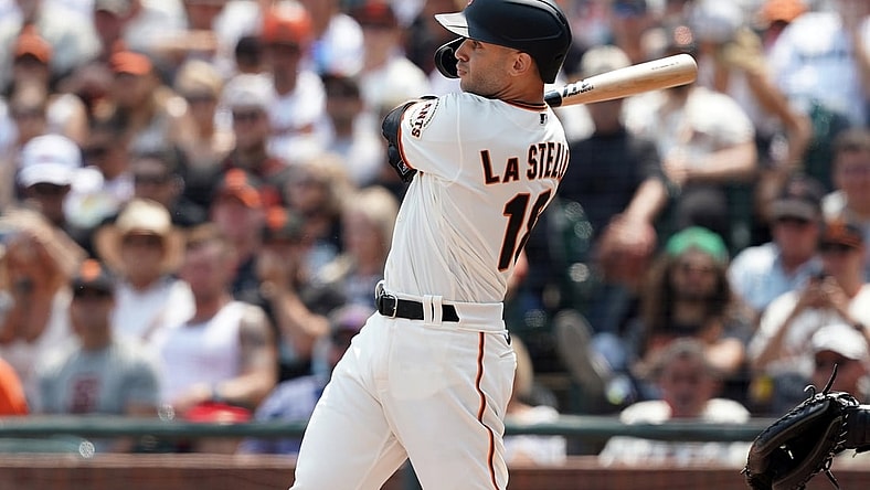 Aug 15, 2021; San Francisco, California, USA; San Francisco Giants second baseman Tommy La Stella (18) hits a two-RBI double during the fifth inning against the Colorado Rockies at Oracle Park. Mandatory Credit: Darren Yamashita-USA TODAY Sports