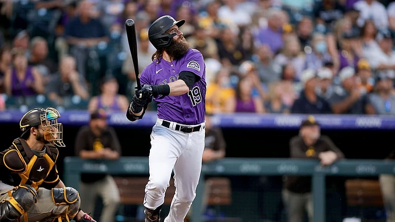 Aug 16, 2021; Denver, Colorado, USA; Colorado Rockies right fielder Charlie Blackmon (19) hits a two run home run in the third inning against the San Diego Padres at Coors Field. Mandatory Credit: Isaiah J. Downing-USA TODAY Sports