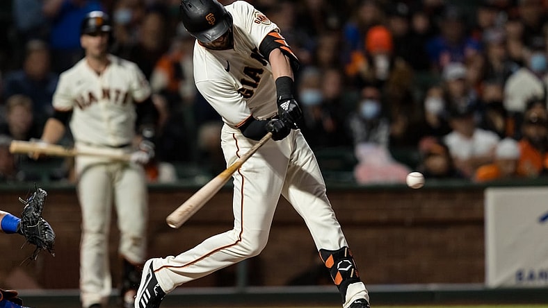 Aug 16, 2021; San Francisco, California, USA; San Francisco Giants third baseman Kris Bryant (23) hits a two-run home run against the New York Mets in the fifth inning at Oracle Park. Mandatory Credit: John Hefti-USA TODAY Sports