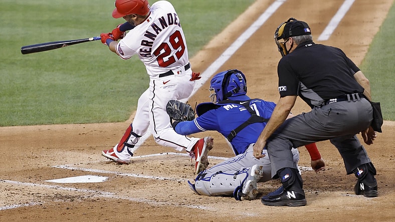 Aug 17, 2021; Washington, District of Columbia, USA; Washington Nationals left fielder Yadiel Hernandez (29) hits a solo home run against the Toronto Blue Jays in the second inning at Nationals Park. Mandatory Credit: Geoff Burke-USA TODAY Sports