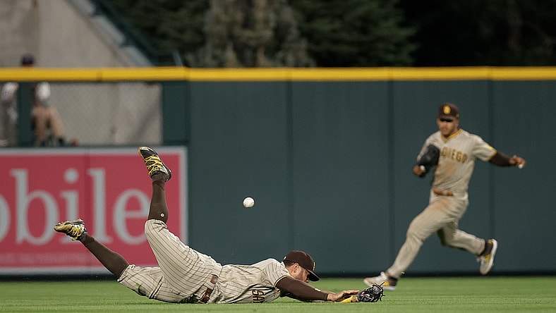 Aug 17, 2021; Denver, Colorado, USA; San Diego Padres left fielder Tommy Pham (28) is unable to field the ball in the fourth inning against the Colorado Rockies at Coors Field. Mandatory Credit: Isaiah J. Downing-USA TODAY Sports