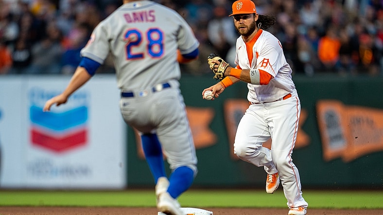 Aug 17, 2021; San Francisco, California, USA;  San Francisco Giants shortstop Brandon Crawford (35) starts the double play as New York Mets third baseman J.D. Davis (28) slides into second base during the fourth inning at Oracle Park. Mandatory Credit: Neville E. Guard-USA TODAY Sports