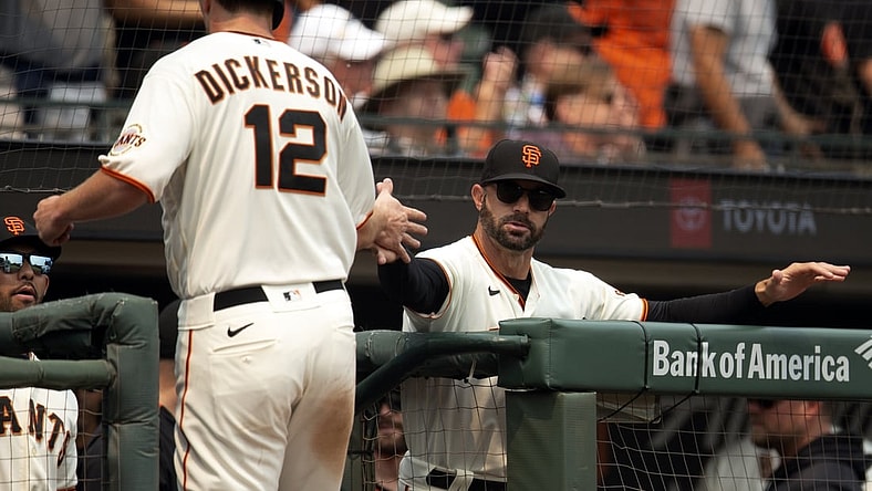 Aug 18, 2021; San Francisco, California, USA; San Francisco Giants manager Gabe Kapler (19) greets left fielder Alex Dickerson (12) after he scored on a double by pinch hitter Wilmer Flores during the third inning against the New York Mets at Oracle Park. Mandatory Credit: D. Ross Cameron-USA TODAY Sports