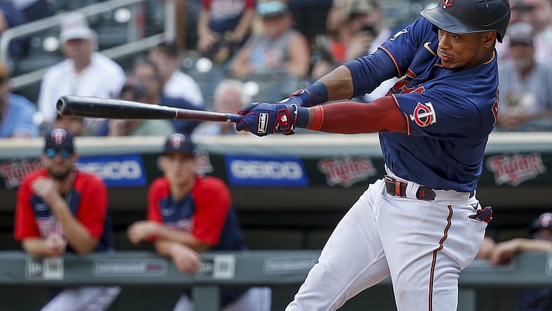 Aug 18, 2021; Minneapolis, Minnesota, USA; Minnesota Twins second baseman Jorge Polanco (11) hits an RBI single against the Cleveland Indians to win the game in the eleventh inning at Target Field. Mandatory Credit: Bruce Kluckhohn-USA TODAY Sports