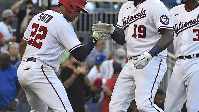 Aug 18, 2021; Washington, District of Columbia, USA; Washington Nationals first baseman Josh Bell (19) celebrates with right fielder Juan Soto (22) after hitting a three run home run against the Toronto Blue Jays during the seventh inning at Nationals Park. Mandatory Credit: Brad Mills-USA TODAY Sports