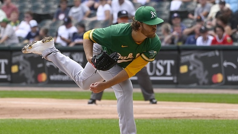 Aug 19, 2021; Chicago, Illinois, USA; Oakland Athletics starting pitcher Cole Irvin (19) delivers against the Chicago White Sox during the first inning at Guaranteed Rate Field. Mandatory Credit: Matt Marton-USA TODAY Sports