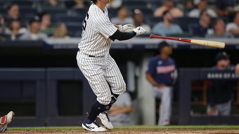 Aug 19, 2021; Bronx, New York, USA; New York Yankees catcher Kyle Higashioka (66) tosses his bat after hitting a two run home run against the Minnesota Twins during the fourth inning at Yankee Stadium. Mandatory Credit: Brad Penner-USA TODAY Sports