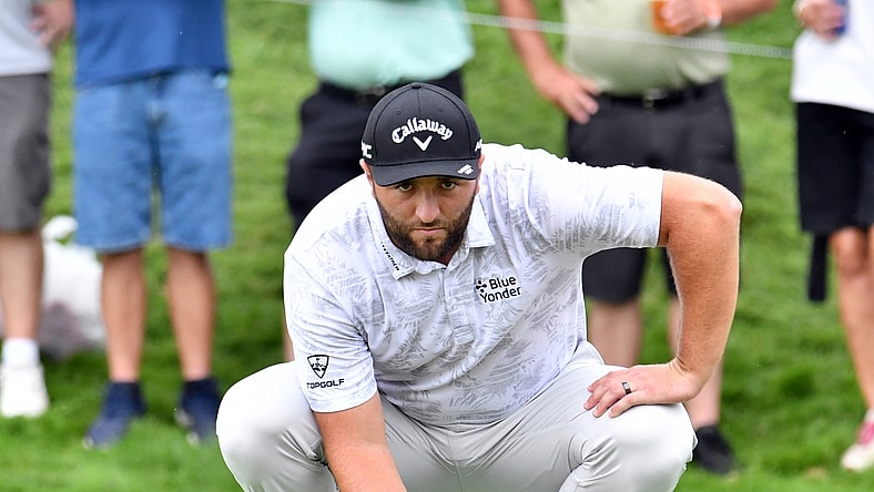 Aug 20, 2021; Jersey City, New Jersey, USA; Jon Rahm lines up his putt on the 16th green during the second round of The Northern Trust golf tournament at the Liberty National Golf Club. Mandatory Credit: Mark Konezny-USA TODAY Sports