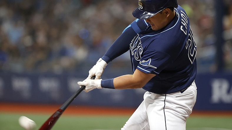 Aug 20, 2021; St. Petersburg, Florida, USA; Tampa Bay Rays first baseman Ji-Man Choi (26) hits a home run during the second inning against the Chicago White Sox at Tropicana Field. Mandatory Credit: Kim Klement-USA TODAY Sports
