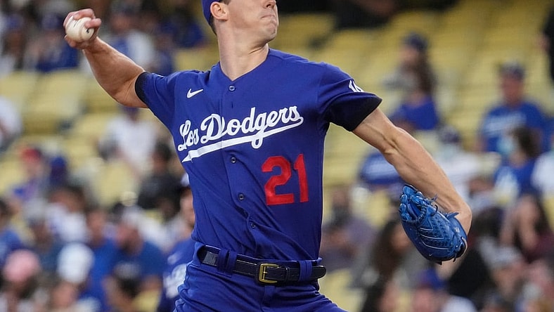 Aug 20, 2021; Los Angeles, California, USA; Los Angeles Dodgers starting pitcher Walker Buehler (21) throws a pitch during the first inning against the New York Mets at Dodger Stadium. Mandatory Credit: Robert Hanashiro-USA TODAY Sports