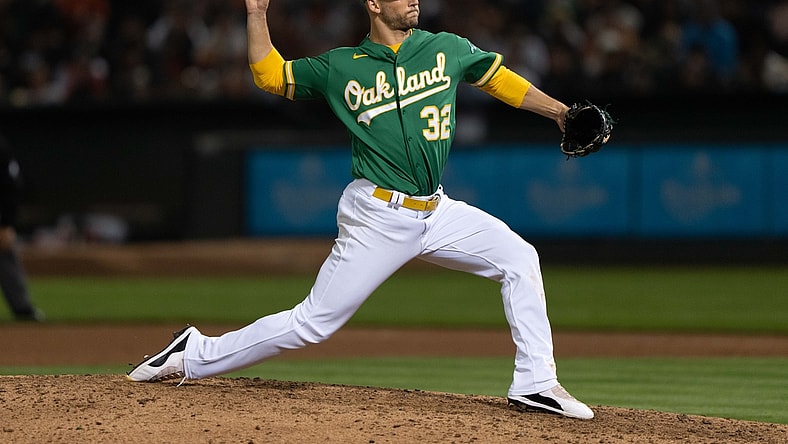 Aug 20, 2021; Oakland, California, USA;  Oakland Athletics pitcher James Kaprielian (32) pitches during the fifth inning against the San Francisco Giants at RingCentral Coliseum. Mandatory Credit: Stan Szeto-USA TODAY Sports