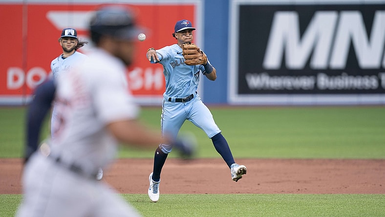 Aug 21, 2021; Toronto, Ontario, CAN; Toronto Blue Jays second baseman Santiago Espinal (5) throws a ball to first base for the out during the second inning against the Detroit Tigers at Rogers Centre. Mandatory Credit: Nick Turchiaro-USA TODAY Sports