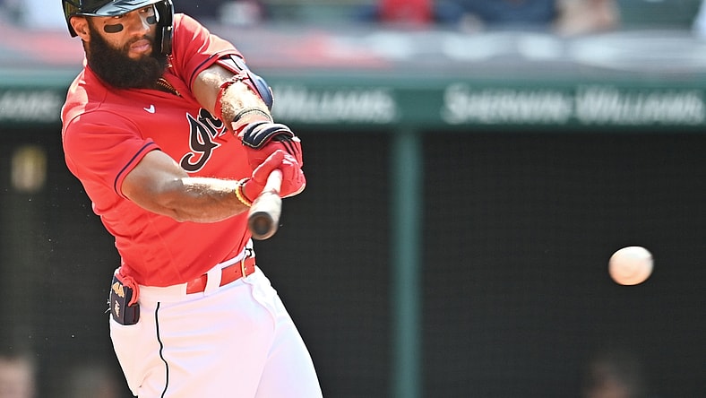 Aug 21, 2021; Cleveland, Ohio, USA; Cleveland Indians shortstop Amed Rosario (1) hits a single during the first inning against the Los Angeles Angels at Progressive Field. Mandatory Credit: Ken Blaze-USA TODAY Sports