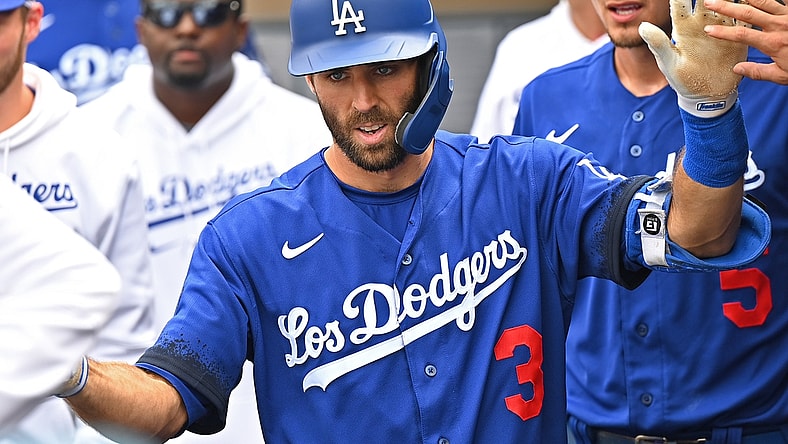 Aug 21, 2021; Los Angeles, California, USA;  Los Angeles Dodgers left fielder Chris Taylor (3) is greeted in the dugout after hitting a solo home run in the fourth inning of the game against the New York Mets at Dodger Stadium. Mandatory Credit: Jayne Kamin-Oncea-USA TODAY Sports