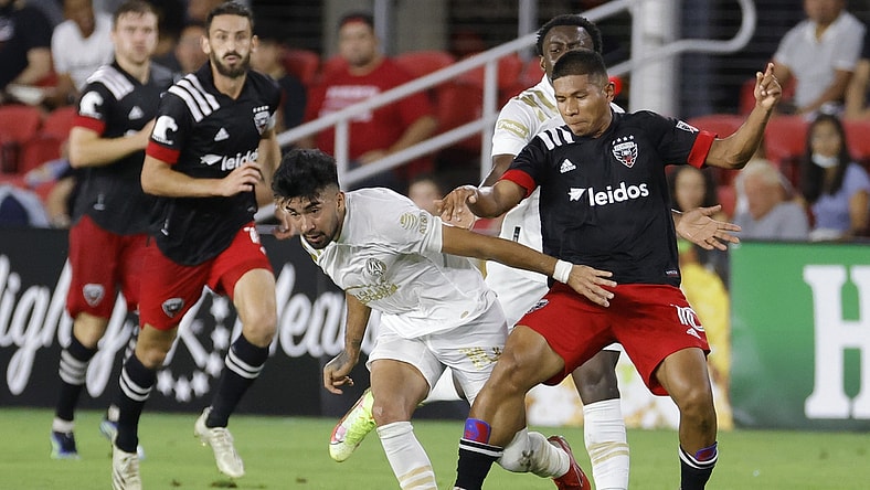 Aug 21, 2021; Washington, DC, Washington, DC, USA; Atlanta United FC midfielder Marcelino Moreno (10) and D.C. United forward Edison Flores (10) battle for the ball in the first half at Audi Field. Mandatory Credit: Geoff Burke-USA TODAY Sports