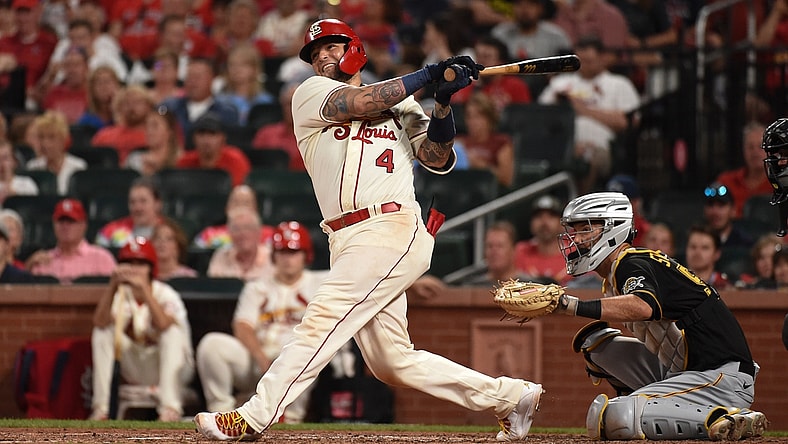 Aug 21, 2021; St. Louis, Missouri, USA; St. Louis Cardinals catcher Yadier Molina (4) hits an RBI single against the Pittsburgh Pirates during the sixth inning at Busch Stadium. Mandatory Credit: Joe Puetz-USA TODAY Sports
