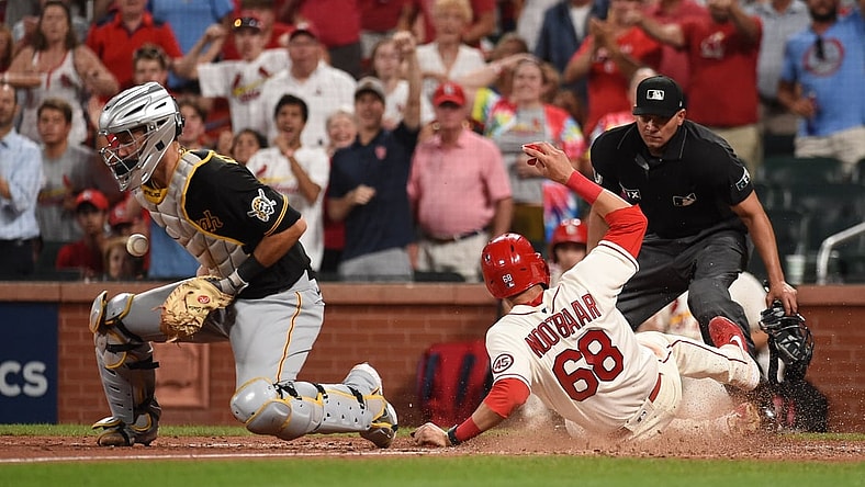 Aug 21, 2021; St. Louis, Missouri, USA; St. Louis Cardinals right fielder Lars Nootbaar (68) scores a run past Pittsburgh Pirates catcher Jacob Stallings (58) during the sixth inning at Busch Stadium. Mandatory Credit: Joe Puetz-USA TODAY Sports