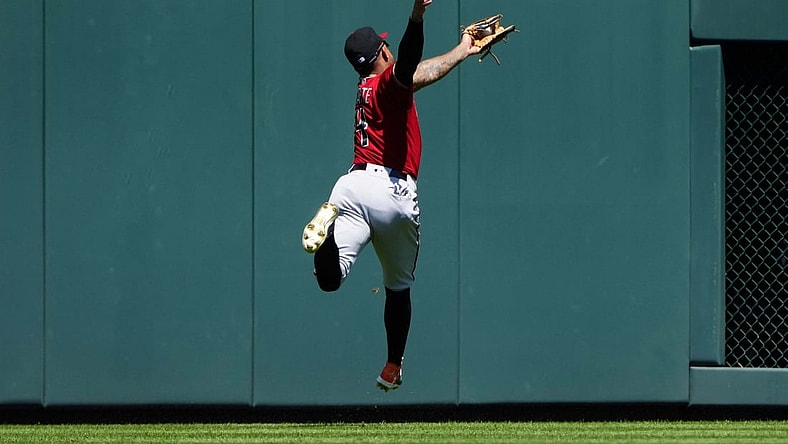Aug 22, 2021; Denver, Colorado, USA; Arizona Diamondbacks second baseman Ketel Marte (4) fields the ball in the first inning against the Colorado Rockies at Coors Field. Mandatory Credit: Ron Chenoy-USA TODAY Sports