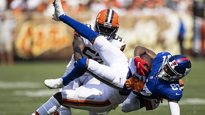 Aug 22, 2021; Cleveland, Ohio, USA; New York Giants wide receiver Damion Willis (87) falls as Cleveland Browns cornerback A.J. Green (38) tackles him during the fourth quarter at FirstEnergy Stadium. Mandatory Credit: Scott Galvin-USA TODAY Sports