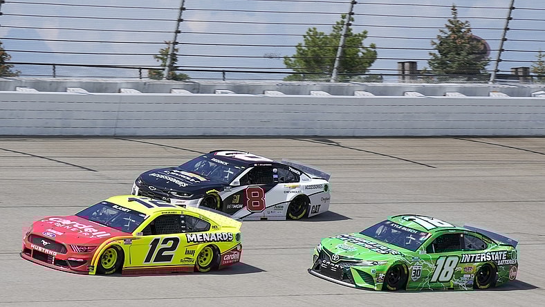 Aug 22, 2021; Brooklyn, Michigan, USA; NASCAR Cup Series driver Ryan Blaney (12), driver Tyler Reddick (8) and driver Kyle Busch (18) during the FireKeepers Casino 400 at Michigan International Speedway. Mandatory Credit: Mike Dinovo-USA TODAY Sports