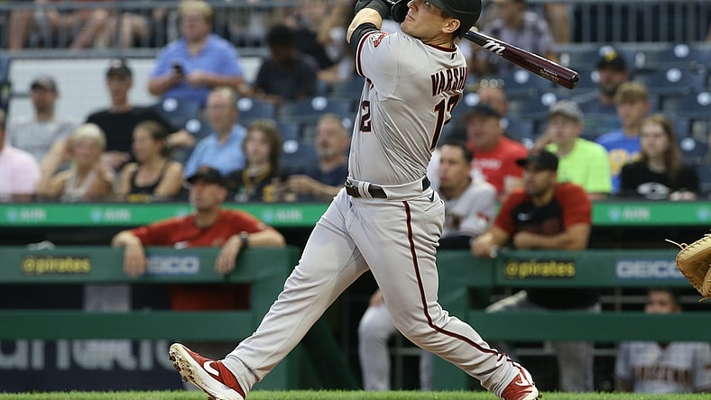 Aug 23, 2021; Pittsburgh, Pennsylvania, USA; Arizona Diamondbacks right fielder Daulton Varsho (12) hits a solo home run against the Pittsburgh Pirates during the second inning at PNC Park. Mandatory Credit: Charles LeClaire-USA TODAY Sports