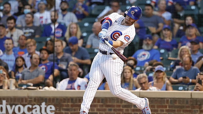 Aug 23, 2021; Chicago, Illinois, USA; Chicago Cubs center fielder Ian Happ (8) doubles against the Colorado Rockies during the first inning at Wrigley Field. Mandatory Credit: Kamil Krzaczynski-USA TODAY Sports