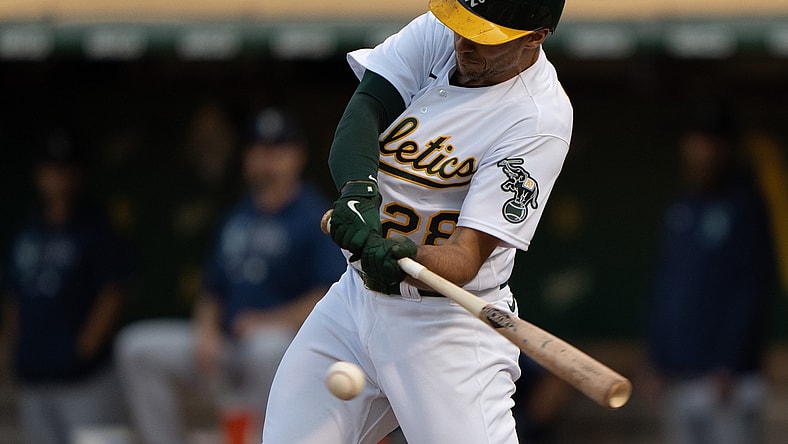 Aug 23, 2021; Oakland, California, USA;  Oakland Athletics first baseman Matt Olson (28) hits a single against the Seattle Mariners during the first inning at RingCentral Coliseum. Mandatory Credit: Stan Szeto-USA TODAY Sports