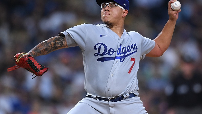 Aug 24, 2021; San Diego, California, USA; Los Angeles Dodgers starting pitcher Julio Urias (7) throws a pitch against the San Diego Padres during the first inning at Petco Park. Mandatory Credit: Orlando Ramirez-USA TODAY Sports