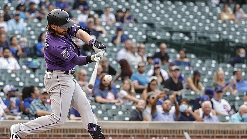 Aug 25, 2021; Chicago, Illinois, USA; Colorado Rockies shortstop Brendan Rodgers (7) hits a two-run home run against the Chicago Cubs during the first inning in game two of a doubleheader at Wrigley Field. Mandatory Credit: Kamil Krzaczynski-USA TODAY Sports