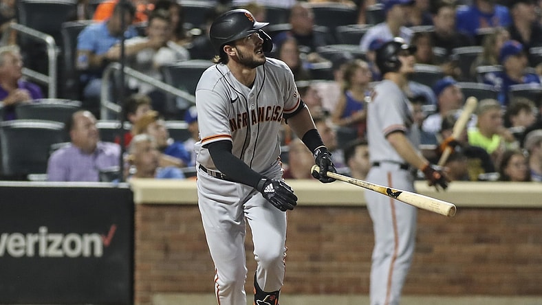 Aug 25, 2021; New York City, New York, USA;  San Francisco Giants third baseman Kris Bryant (23) hits a solo home run in the fourth inning against the New York Mets at Citi Field. Mandatory Credit: Wendell Cruz-USA TODAY Sports