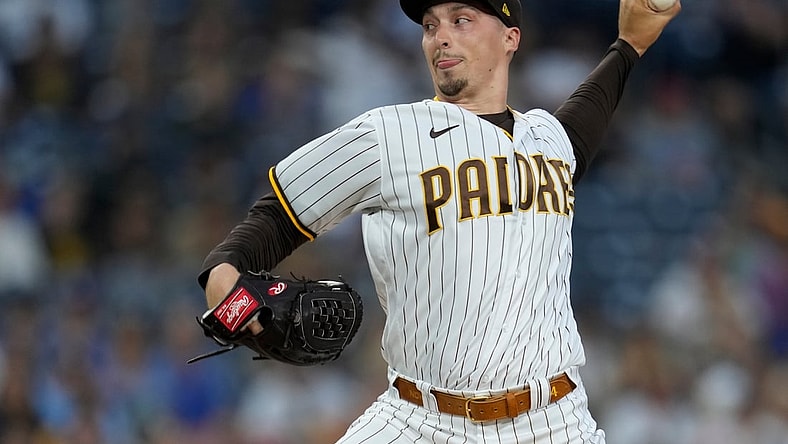 Aug 25, 2021; San Diego, California, USA; San Diego Padres starting pitcher Blake Snell (4) pitches against the Los Angeles Dodgers in the first inning at Petco Park. Mandatory Credit: Ray Acevedo-USA TODAY Sports