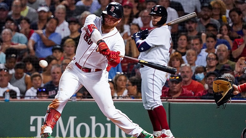 Aug 26, 2021; Boston, Massachusetts, USA; Boston Red Sox left fielder Alex Verdugo (99) drives in a run with a single against the Minnesota Twins in the third inning at Fenway Park. Mandatory Credit: David Butler II-USA TODAY Sports