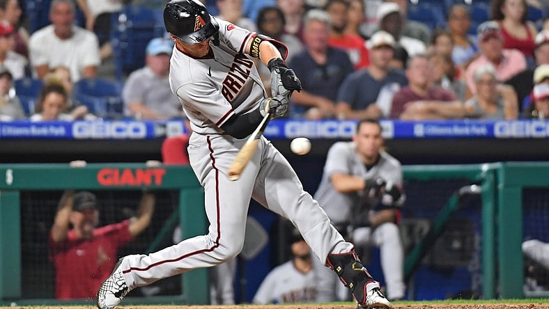 Aug 26, 2021; Philadelphia, Pennsylvania, USA; Arizona Diamondbacks shortstop Nick Ahmed (13) hits a two run home run against the Philadelphia Phillies during the fourth inning at Citizens Bank Park. Mandatory Credit: Eric Hartline-USA TODAY Sports